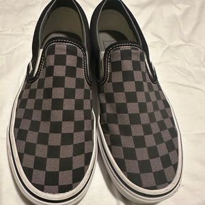 Black and grey slip on Vans